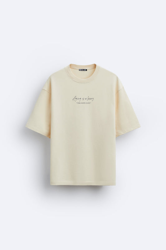 IVORY - AGING IS A LUXURY FRENCH TERRY OVERSIZED T-SHIRT